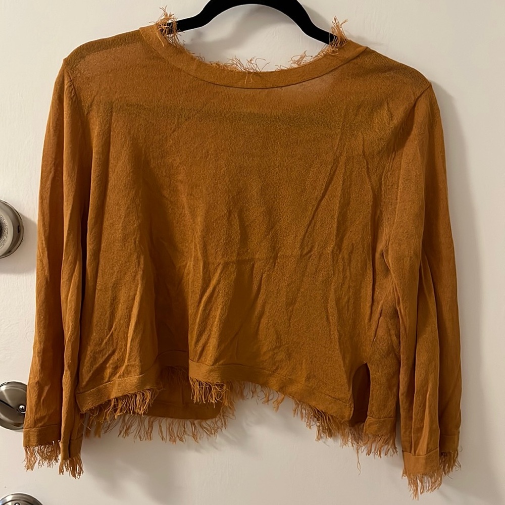 Cropped frayed sweater with open back